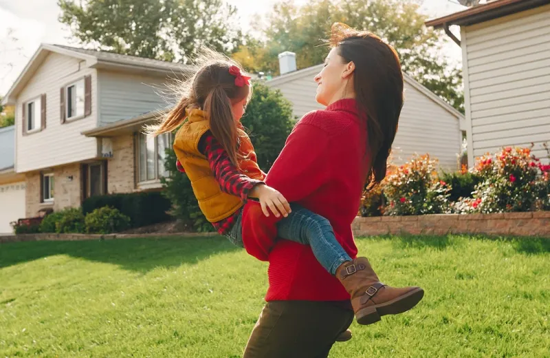 mom and daughter playing outside